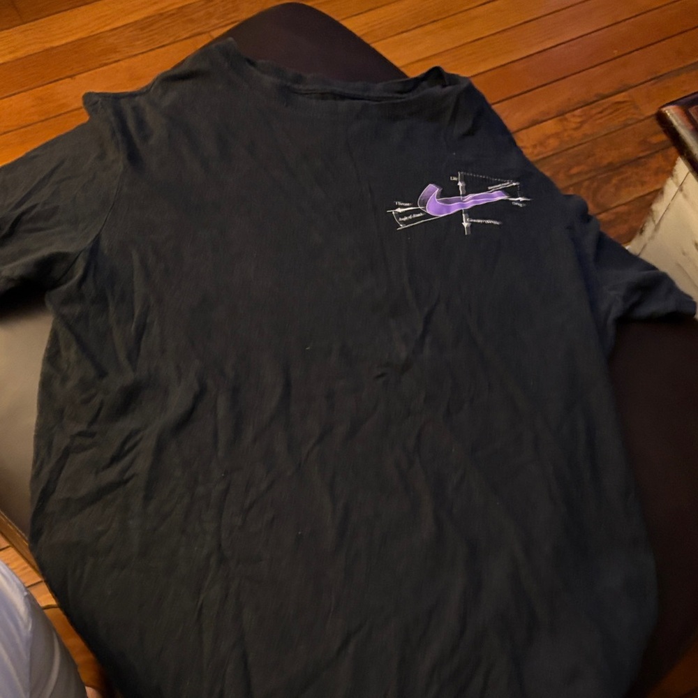 Nike Men's Black Tee with Purple Swoosh